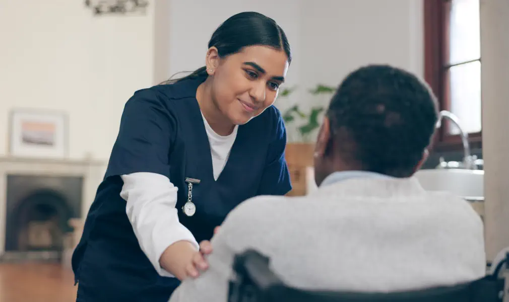 caregiver and an elderly talking