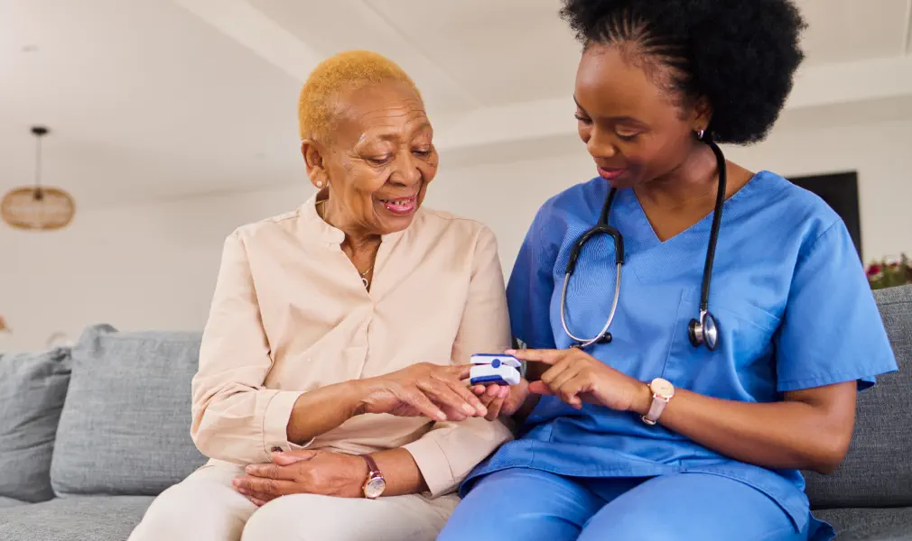 caregiver and an elderly talking